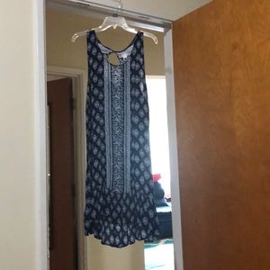 Mid length blue dress.